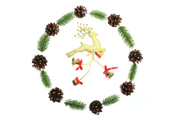 Christmas wreath was made minimalist style from pine cones and evergreen fir branches on the white background. Top view
