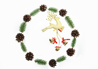 Christmas wreath was made minimalist style from pine cones and evergreen fir branches on the white background. Top view