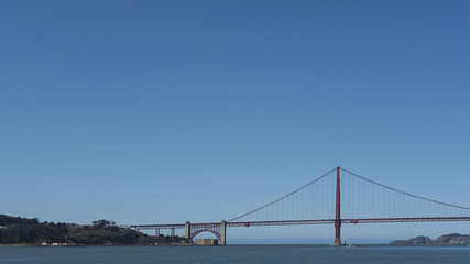 Fototapeta na wymiar Midday light over the south tower of the iconic Golden Gate Bridge, San Francisco, California, USA