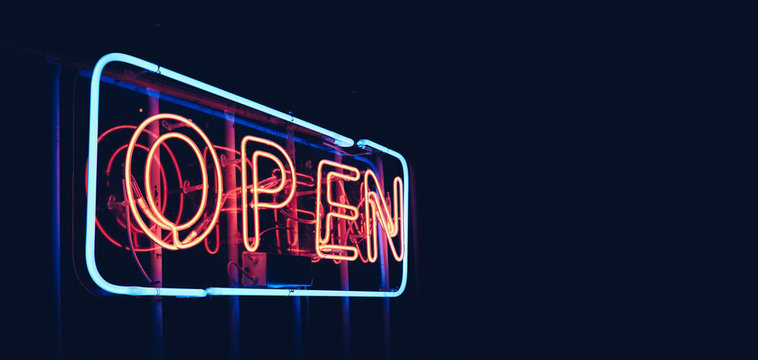 "OPEN" restaurant sign in night time with blank copy space, black background