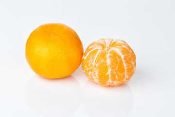 dava ripe mandarin isolated on white background, peeled and not peeled