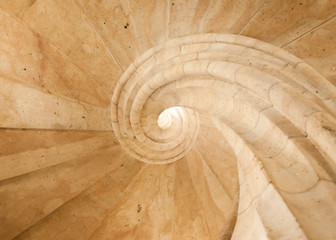 Abstract of a spiral staircase made of light sandstone
