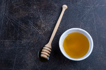 Honey with wooden dipper