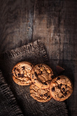 Chocolate chip cookies,  freshly baked on rustic wooden table. Selective Focus. Copy space.