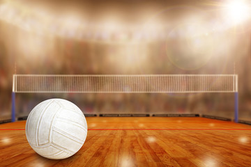 Fictitious volleyball arena with ball on court and copy Space. Focus on foreground with special lighting and lens flare effect on background.