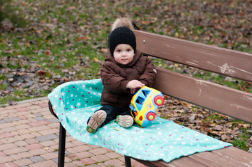 Little boy playing with toy car