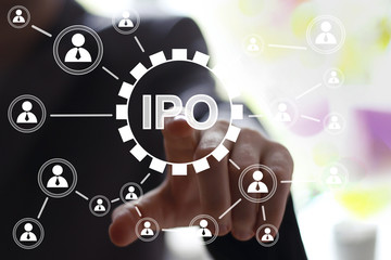 Fototapeta premium Businessman hand press button ipo symbol network