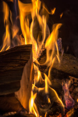 blazing firewood on a fireplace 