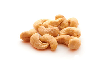Cashew nuts heap on white background