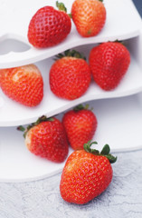 Heap Of Fresh Red Ripe Strawberries On White Box Board. Fresh summer Fruits. Isolated. Food. Vertical Image.