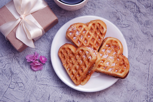 Waffles with Cream Heart Shape with Gift Box on Rustic Wooden Background. Valentine's Day Background. Love Concept. Top View.