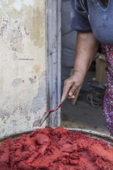 Preparing homemade tomato paste in Turkey
