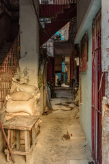 Fototapeta na wymiar Back alley of a poor neighborhood in Havana, Cuba