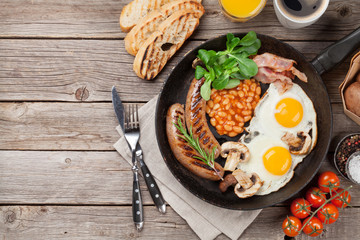English breakfast. Fried eggs, sausages, bacon