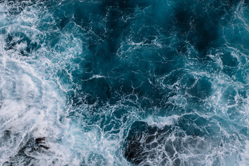 Aerial view to ocean waves. Blue water background - Powered by Adobe