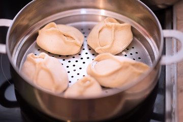 Manti. Traditional meat dish of the peoples of Central Asia on the steamer