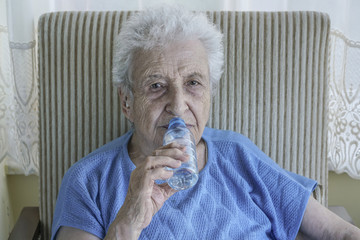 senior woman drinking water