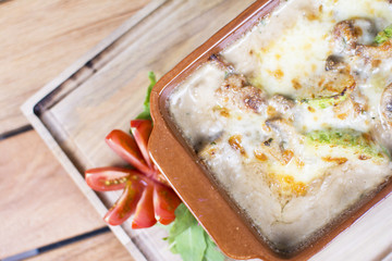 Roasted chicken breast, served with fried potatoes and cooked vegetables. Warm cheese topping with the touch of seasoning. Beautifully served at the restaurant.