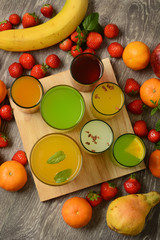assorted fruit juices with ingredients around