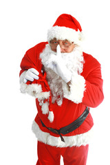 Real Santa Claus carrying big bag full of gifts, isolated on white background