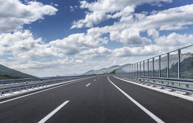 Fototapeta premium High-speed country road among the mountains.