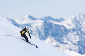 Skier in high mountains