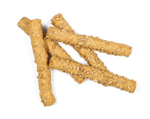 Integral bread sticks with sunflower seeds isolated on white background, top view