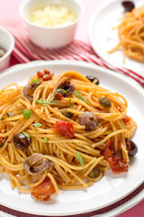 Pasta with tomatoes, olives, capers and anchovies Spaghetti alla puttanesca