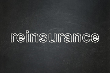 Insurance concept: text Reinsurance on Black chalkboard background