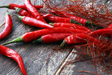 extra hot red chili pepper strings, threads on white background.