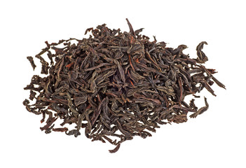 Dry black tea leaves isolated on a white background