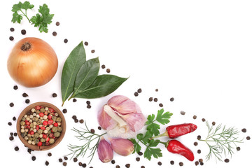 mix of onion, garlic, hot pepper, peppercorn and laurel leaf isolated on white background with copy...