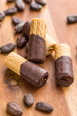 Sweet dessert. Biscuits rolls with chocolate.