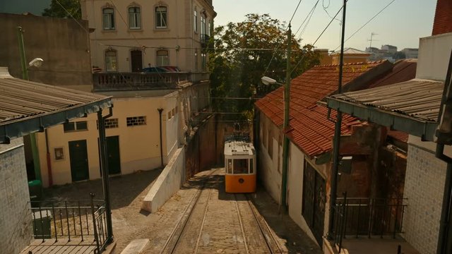 Telephoto shot of the Elevador do Lavra funicular tram elevator, also known as Ascensor do Lavra, in Lisbon, Portugal. Inaugurated in 1884, it is the oldest funicular in Lisbon.