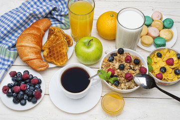 Breakfast served with orange juice, croissants, cereals and fruits. Balanced diet.