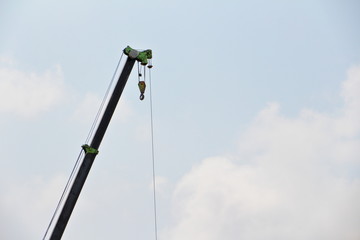 high crane on the blue sky.