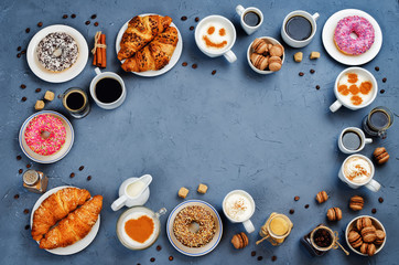 Stone background with different types of coffee and desserts to them