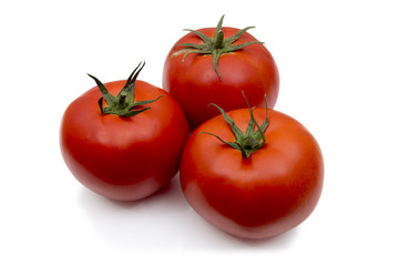 Tomatoes with leaf isolated on white.