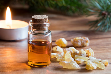 A bottle of frankincense essential oil with frankincense resin
