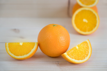 Oranges fruits on wooden table and background