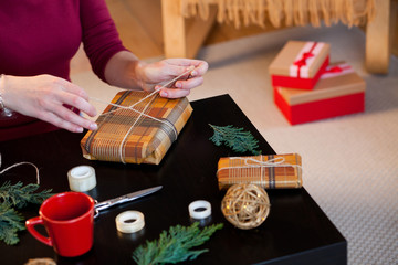 woman wrapping christmas presents