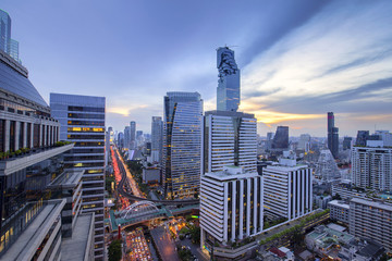 Aerial view of Bangkok modern office buildings, condominium in Bangkok city downtown with sunset...