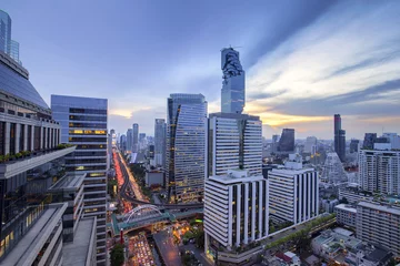 Keuken spatwand met foto Aerial view of Bangkok modern office buildings, condominium in Bangkok city downtown with sunset sky ,Bangkok , Thailand,Bangkok is the most populated city in Southeast Asia. © tool51