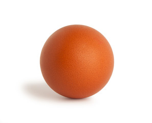 A fresh, brown chicken egg isolated on a white background