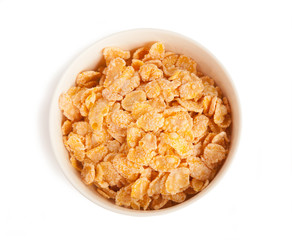 sweet corn flakes in a bowl isolated on a white background