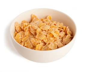 sweet corn flakes in a bowl isolated on a white background