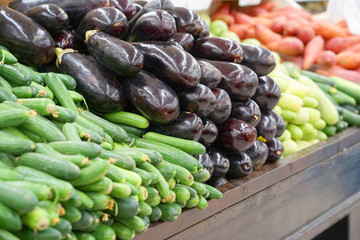 Fresh grown vegetables in market stall ready for sale at farmers market