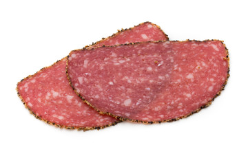 Salami slices isolated on the white background.
