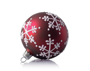 Close-up of beautiful red christmas ball with snowflake pattern