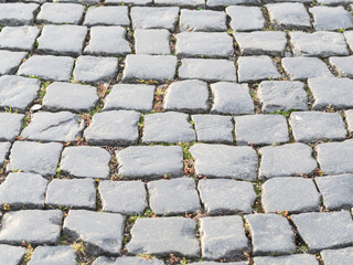 Stone pavement texture of an old road. Texture background.